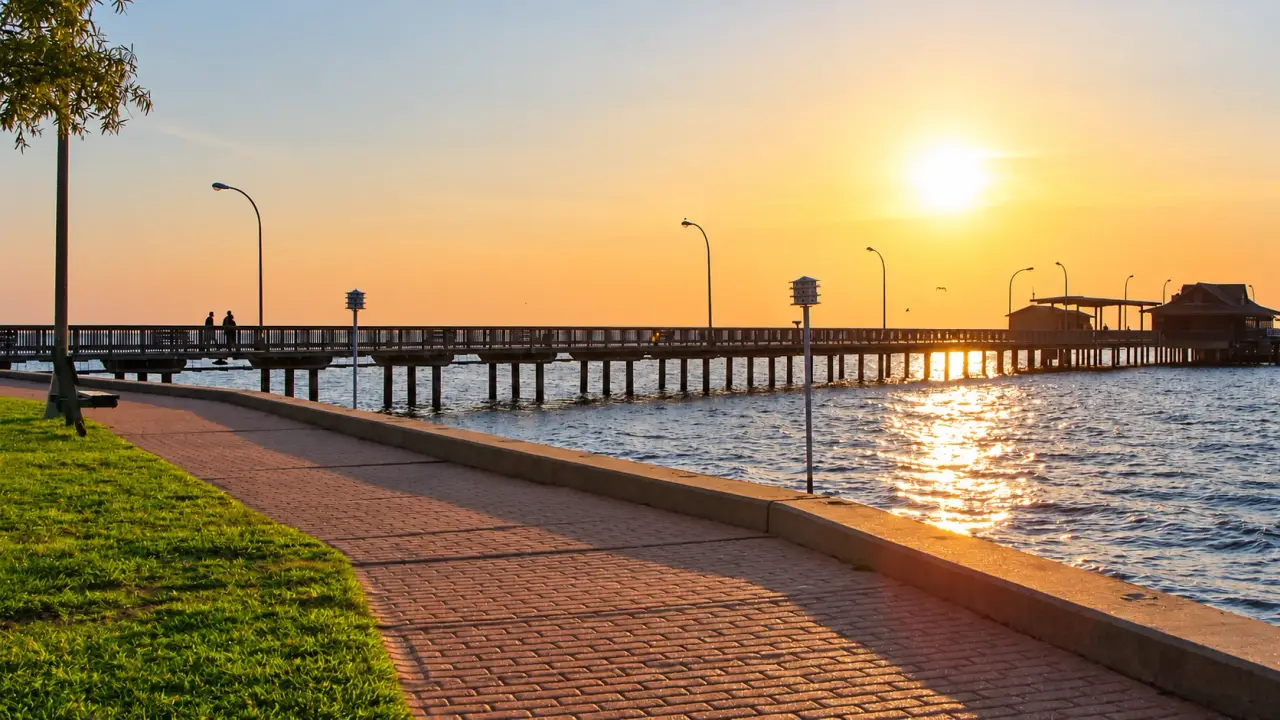 Fairhope Municipal Pier at sunset on Mobile Bay, Alabama.