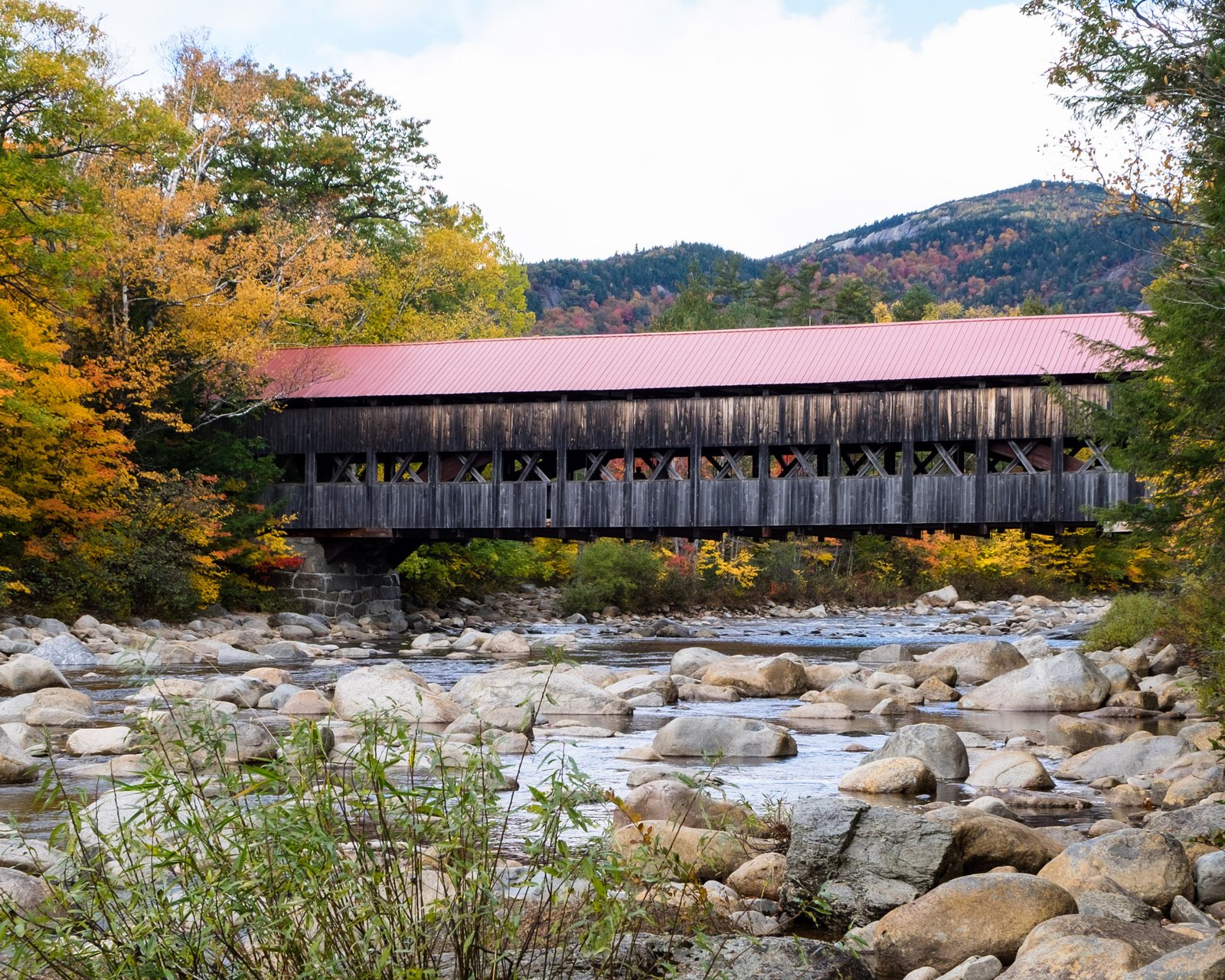 Albany Covered Bridge and autumn foliage along the Swift River