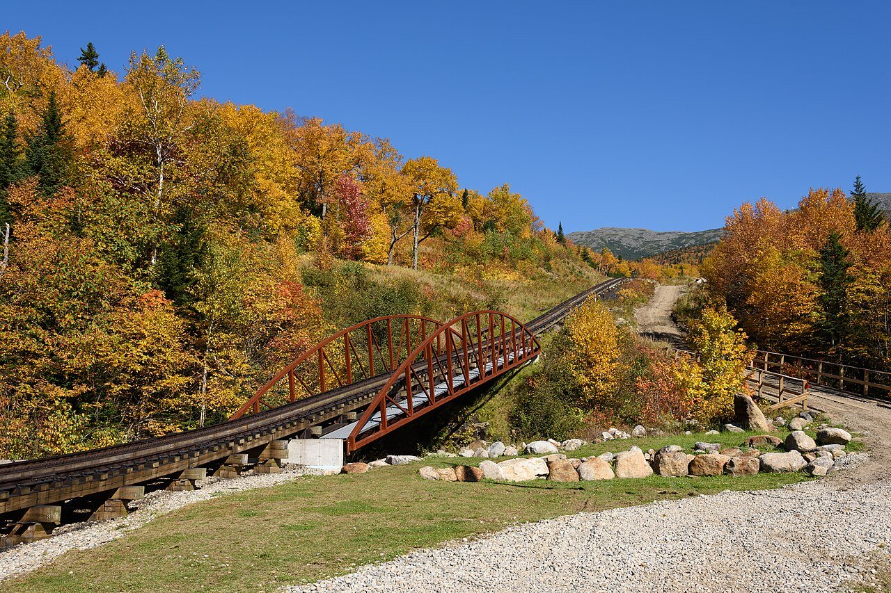 Mount Washington Cog Railway bridge surrounded by autumn foliage